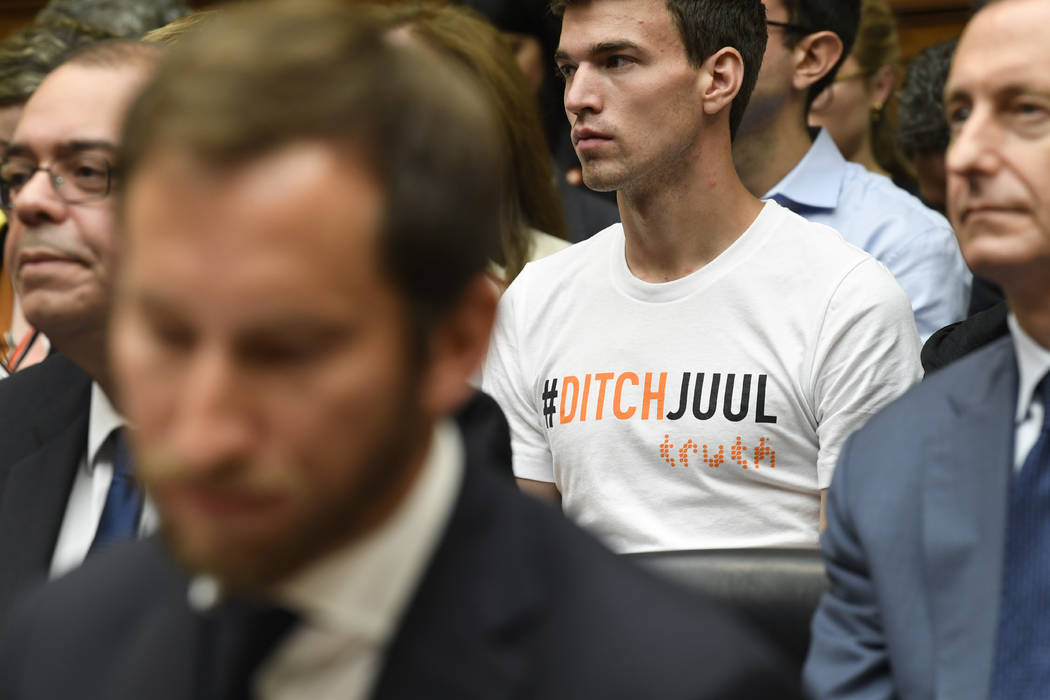 A person in the audience wears a shirt against JUUL as JUUL Labs co-founder and Chief Product O ...