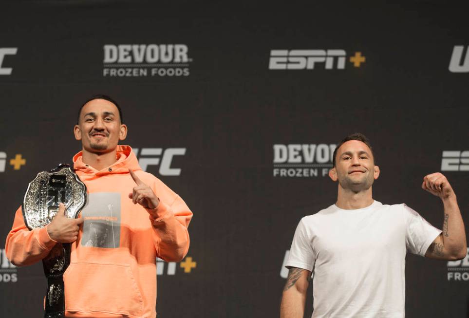 UFC featherweight champion Max Holloway, left, and UFC featherweight contender Frankie Edgar ta ...