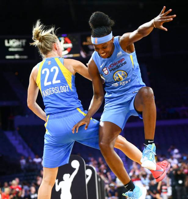 Chicago Sky's Courtney Vandersloot (22) celebrates with Chicago Sky's Diamond DeShields during ...