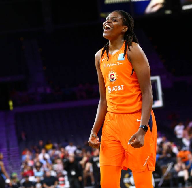 Connecticut Sun's Jonquel Jones celebrates after competing in an obstacle course involving pass ...