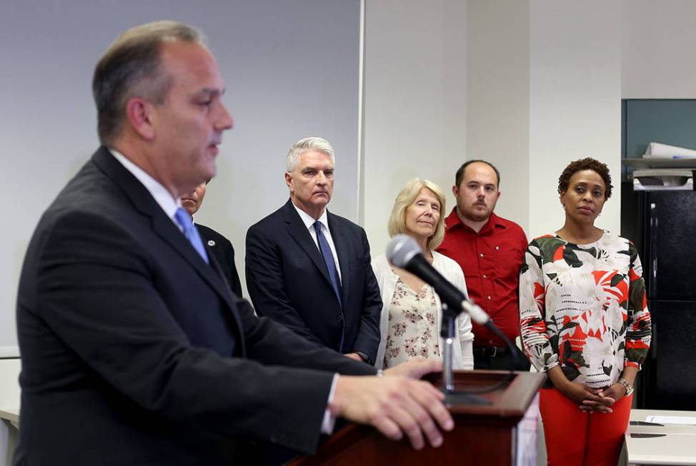 Staff listen as Clark County School Superintendent Dr. Jesus Jara speaks to the media at a pres ...