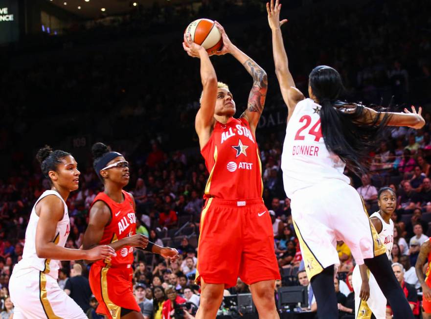 Indiana Fever's Candice Dupree shoots over Phoenix Mercury's DeWanna Bonner during the second h ...