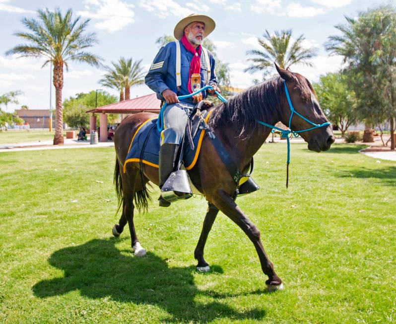 Keith Hill, president trooper of the 9th and 10th Horse Cavalry Association, rides hi ...