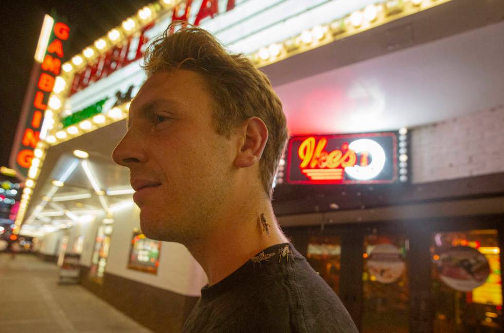 John Smirk poses with grasshoppers outside the El Cortez on Sunday, July 28, 2019 in Las Vegas. ...