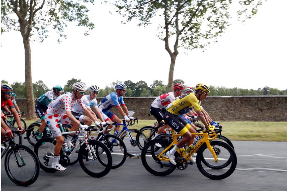 Colombia's Egan Bernal wearing the overall leader's yellow jersey and France's Romain Bardet we ...