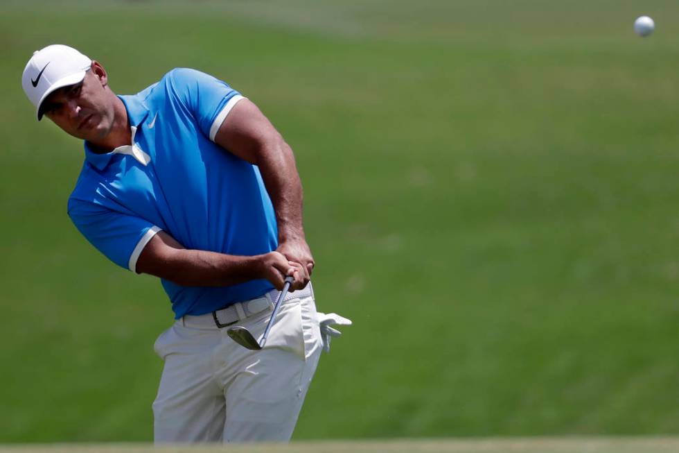 Brooks Koepka chips to the second green during the final round of the World Golf Championships- ...