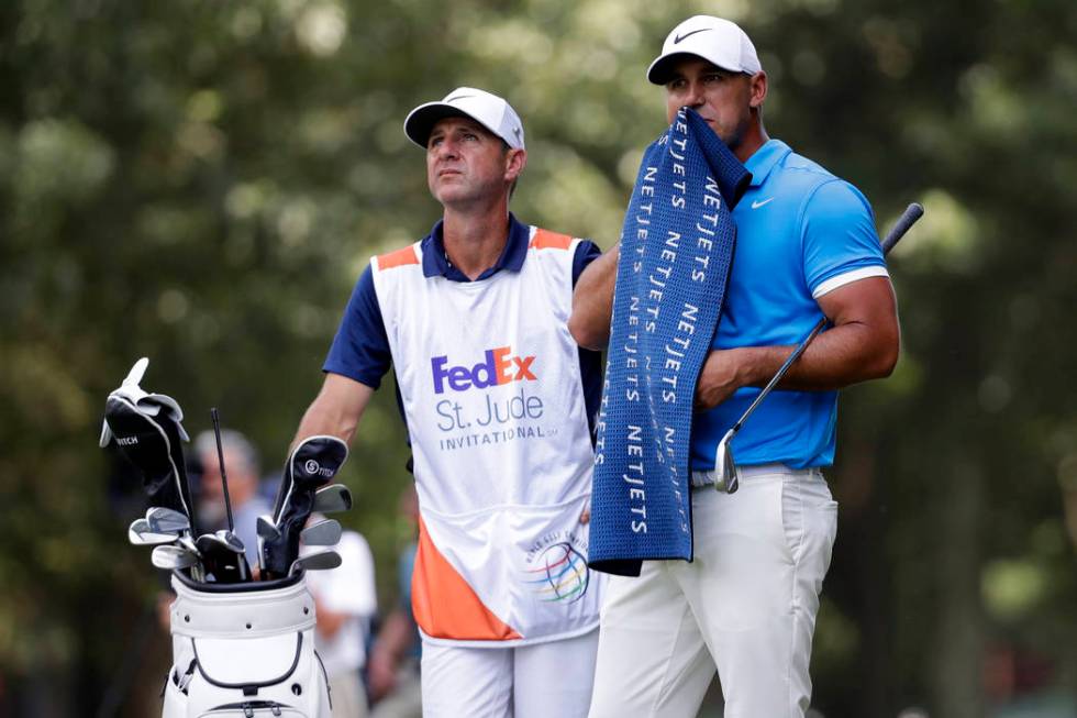 Brooks Koepka prepares to hit on the third fairway during the final round of the World Golf Cha ...