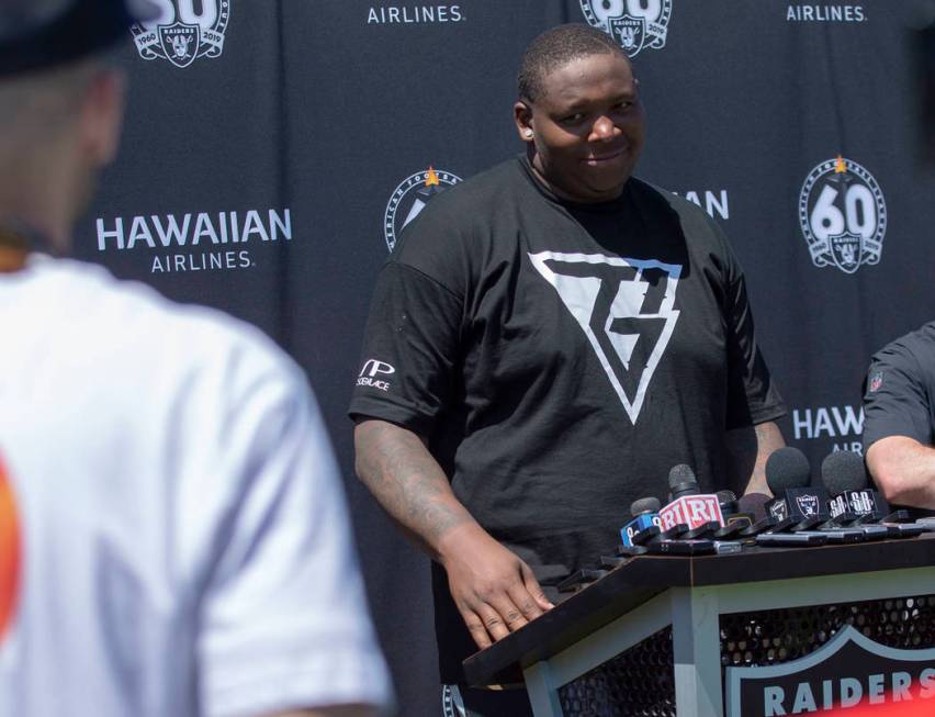 Oakland Raiders offensive tackle Trent Brown (77) takes questions during the NFL team's trainin ...