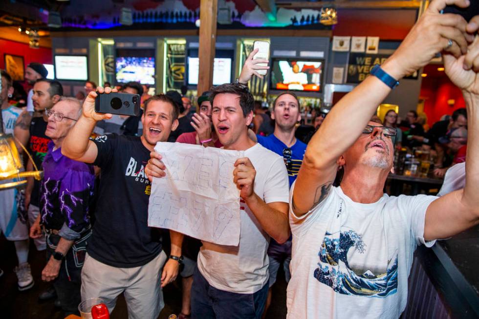 Friends of competitor Wes Davis cheer for him during his round as PT's Ranch hosts a $4,000 win ...