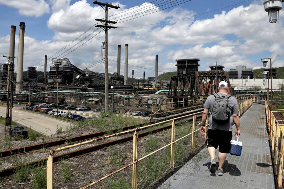 FILE - In this May 2, 2019, file photo a worker arrives for his shift at the U.S. Steel Clairto ...