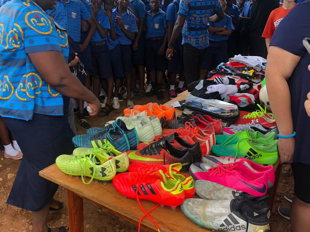 Students at the Kabore School in Ho, Volta Region, Ghana eagerly await selection of soccer shoe ...