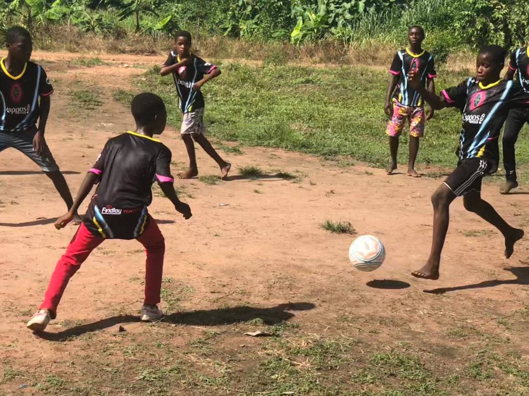 Children of the Vima Orphanage in Tsibu-Bethel, Volta Region, Ghana play a game of soccer after ...