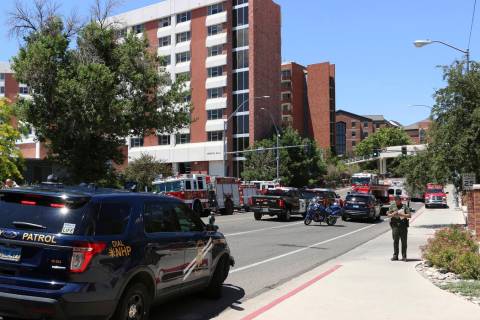 Rescue personnel respond to an explosion that damaged Argenta and Nye Halls on the University o ...