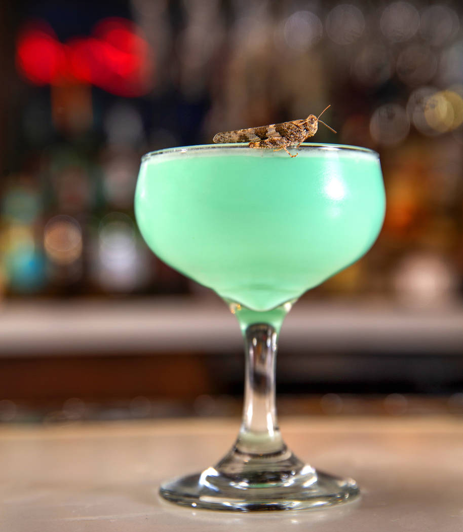 Grasshopper drink with grasshopper on the rim prepared by bartender Sarah Contois at the Smashe ...