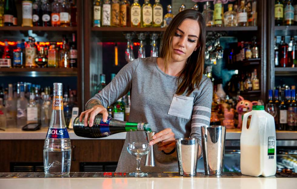 Bartender Sarah Contois at the Smashed Pig prepares a grasshopper drink on Sunday, July 27, 201 ...