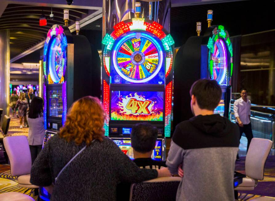 Gamblers play slots at SLS Las Vegas on Thursday, May, 30, 2019, in Las Vegas. (Benjamin Hager/ ...