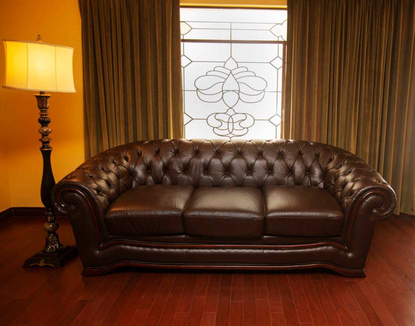 A remodeled lamp and couch of a guest room of the historic Hotel Apache at Binion's Gambling Ha ...