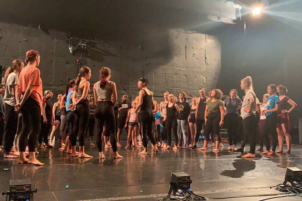 Participants in the 21st annual Las Vegas Dance in the Desert Festival huddle before practicing ...