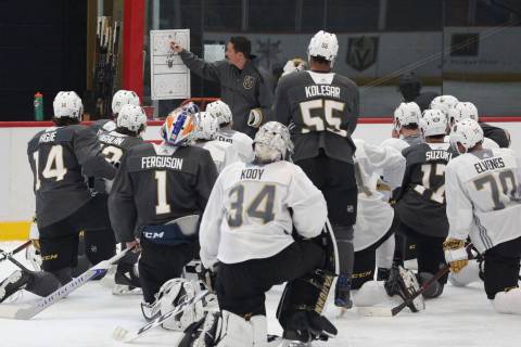Golden Knights coach Chris Dennis lays out a practice plan during Knights rookie camp practice ...