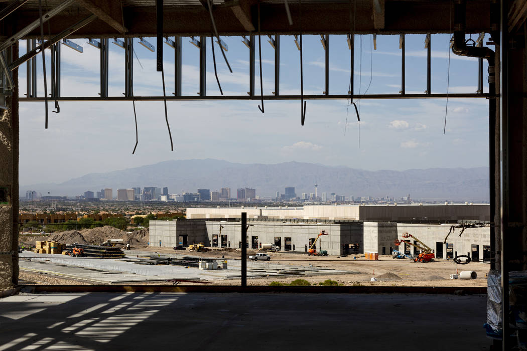 A view of the Las Vegas Strip is seen at the Raiders' headquarters construction site in Henders ...