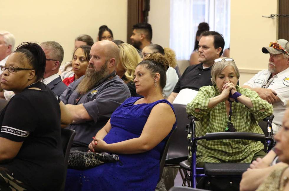 Southern Nevada Regional Housing Authority employees, including Martha Floyd, second right, att ...