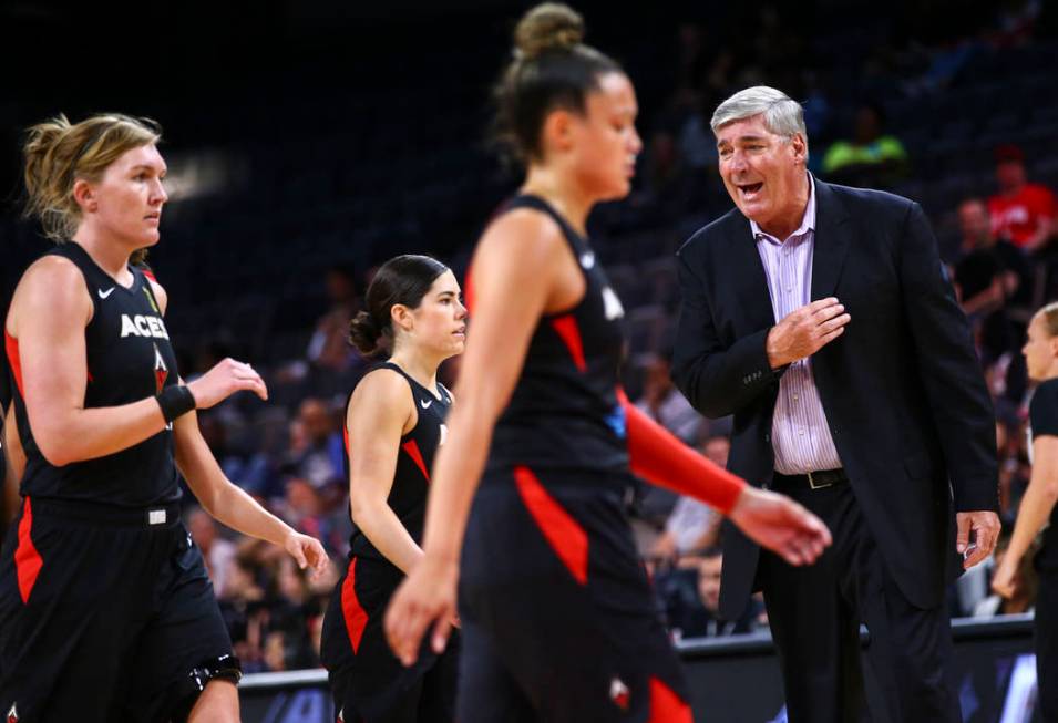 Las Vegas Aces coach Bill Laimbeer, right, talks with his team during the first half of a WNBA ...