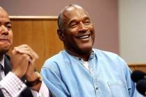 In this July 20, 2017, file photo, former NFL football star O.J. Simpson reacts after learning ...