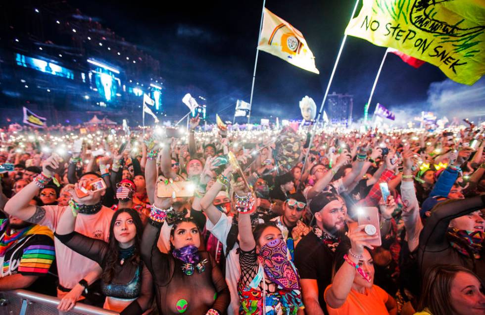 A sea of concert goers dance during SAYMYNAME's performance at the Circuit Grounds stage on day ...