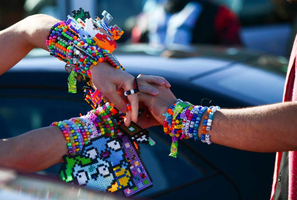 Alex Spry, of Moreno Valley, Calif., left, trades kandi with Esteban Hernandez, of N. J., as El ...