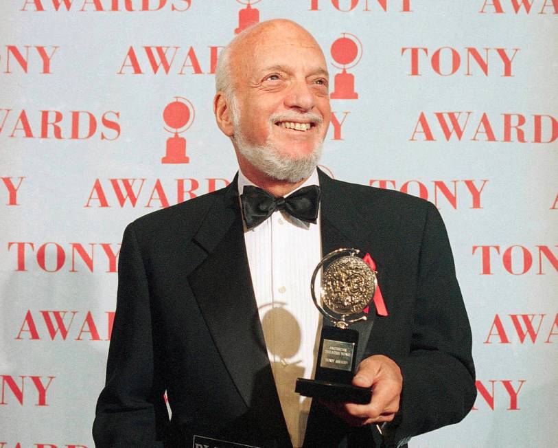 FILE - In this June 4, 1995 file photo, Harold Prince holds his Tony award for best director in ...