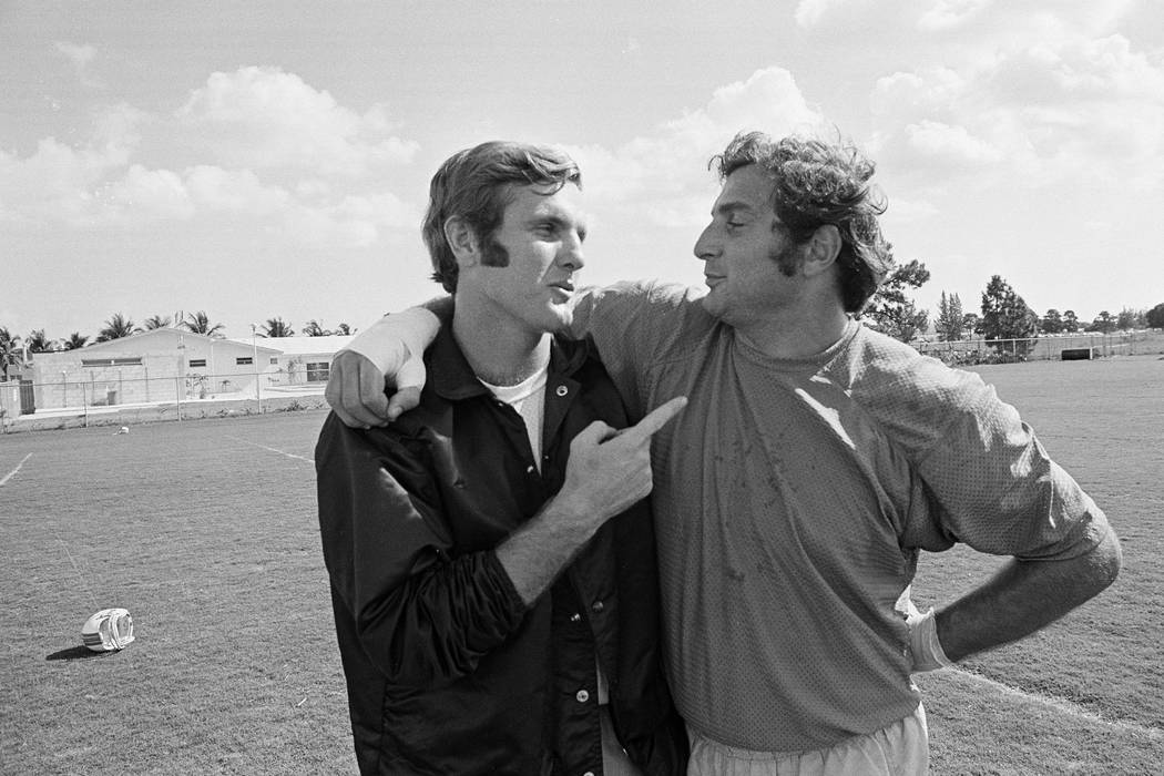 FILE - In this Jan. 5, 1972, file photo, Miami quarterback Bob Griese, left, and linebacker Nic ...