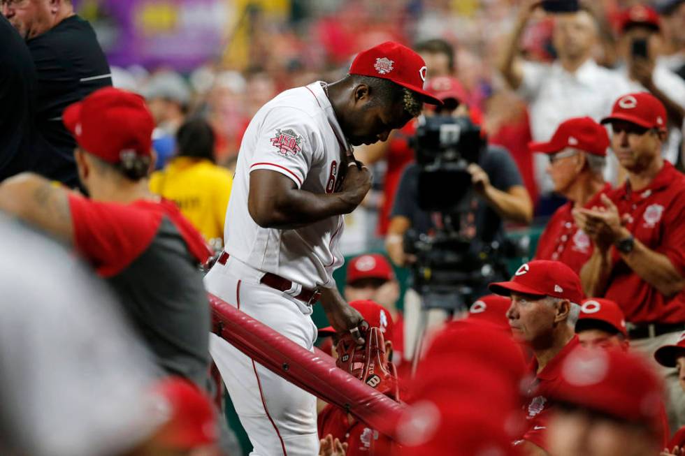 Cincinnati Reds right fielder Yasiel Puig leaves the field at the end of the top of the ninth i ...