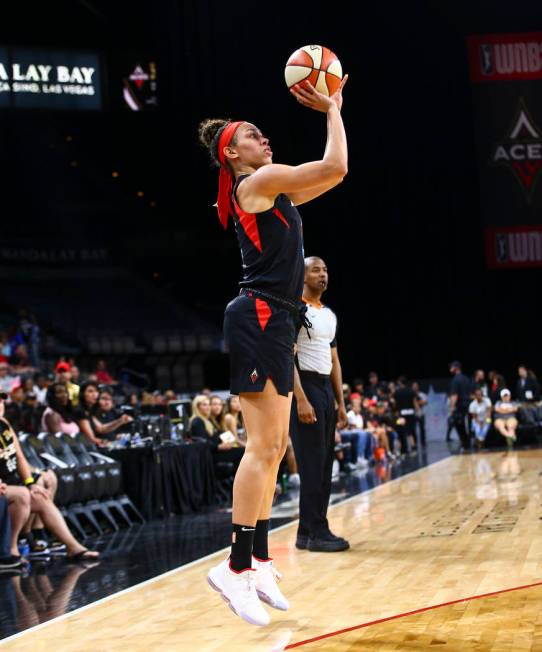 Las Vegas Aces' Dearica Hamby (5) shoots against the Dallas Wings during the first half of a WN ...