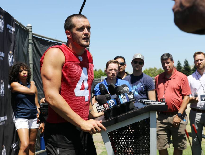 Oakland Raiders quarterback Derek Carr (4) answers questions during the NFL team's training cam ...