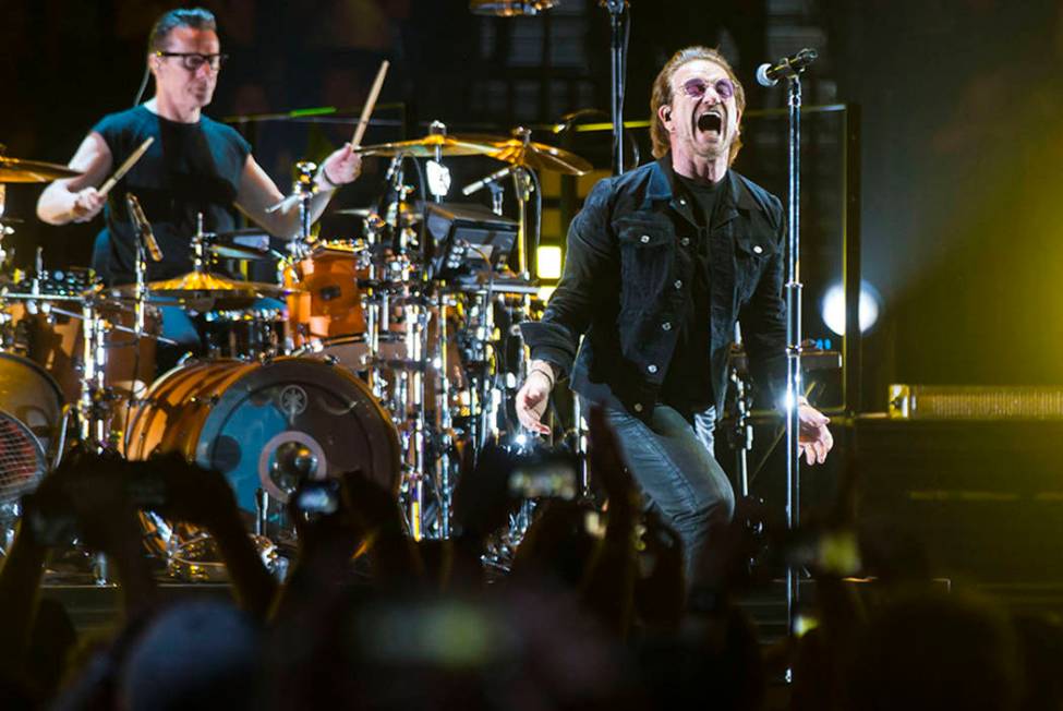 Larry Mullen Jr., left, and Bono of U2 perform at T-Mobile Arena in Las Vegas on Friday, May 11 ...