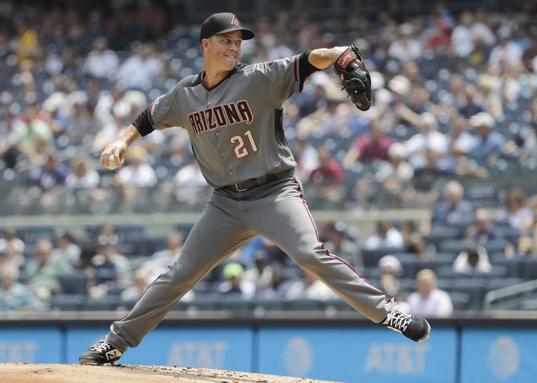 Arizona Diamondbacks' Zack Greinke delivers a pitch during the first inning of a baseball game ...