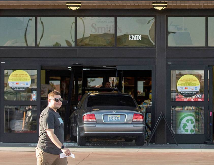 A car crashes into the Smith’s Marketplace, at 9710 West Skye Canyon Park Drive, Wednesd ...