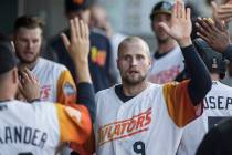 Las Vegas Aviators first baseman Seth Brown (9) high fives his teammates after scoring in the b ...