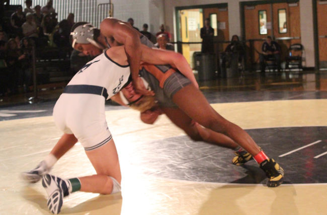 Legacy‘s Dion Jones blocks a shot by Shadow Ridge‘s Jamison Rand, during their 1 ...