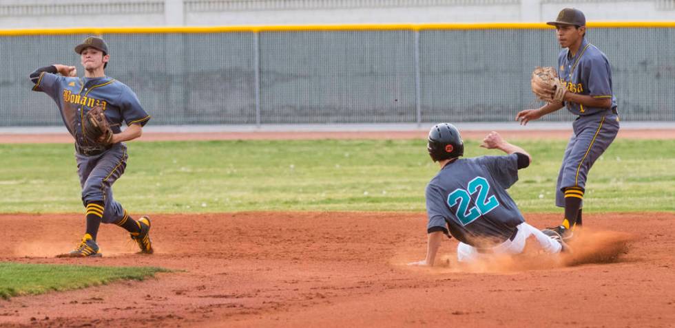 Silverado pitcher Tyler Paasche (22) slides into second base in the second inning during a b ...