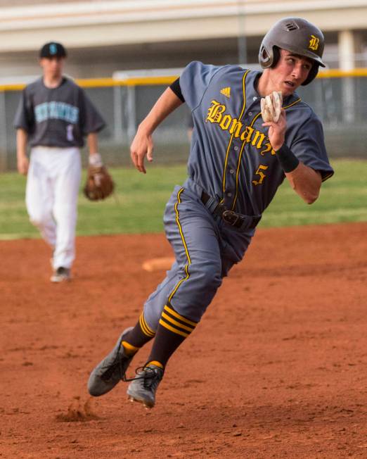 Bonanza second baseman Matthew Cox (5) runs for third base in the fifth inning during a base ...