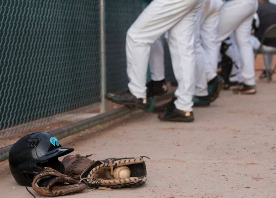 The Silverado High School baseball team waits in the dugout during a baseball game against B ...