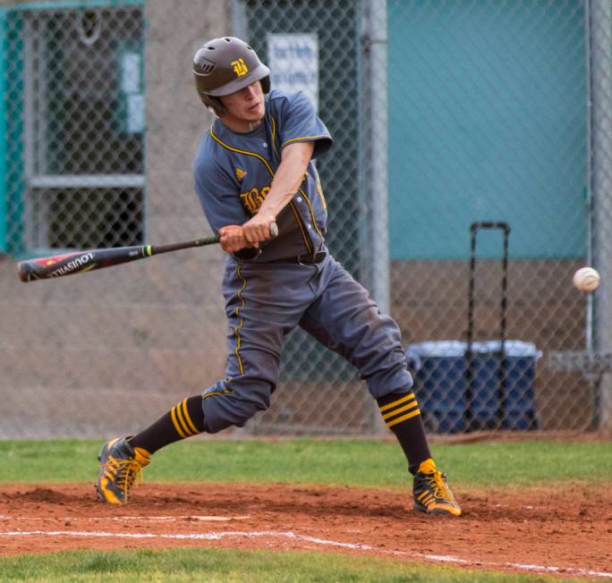 Bonanza shortstop Luis Lares (17) hits a single in the third inning during a baseball game a ...