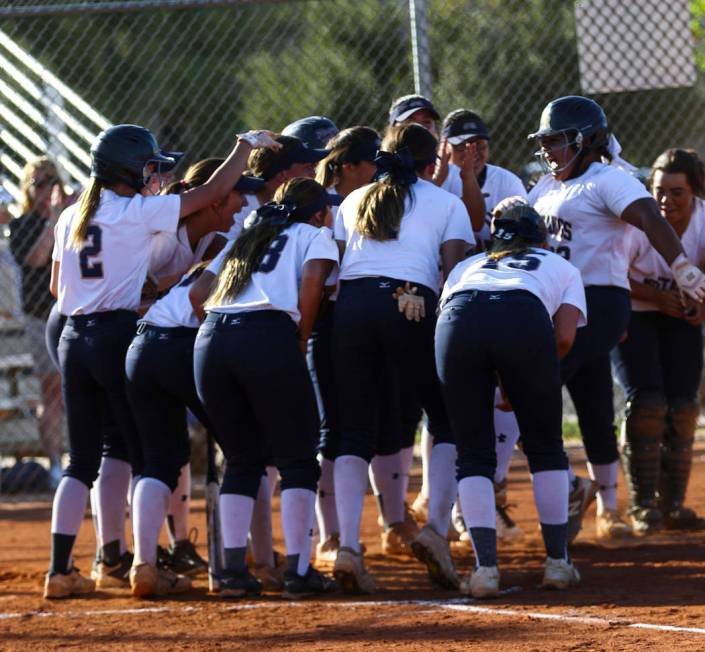 The Shadow Ridge softball team celebrates the home run hit by first baseman Alyssa Stanley ( ...