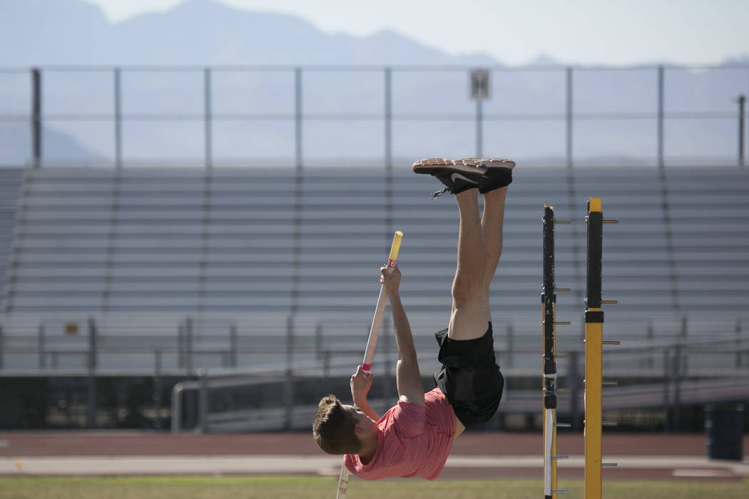 Garett Furlong practices pole vaulting during a track and field practice at Coronado High Sc ...