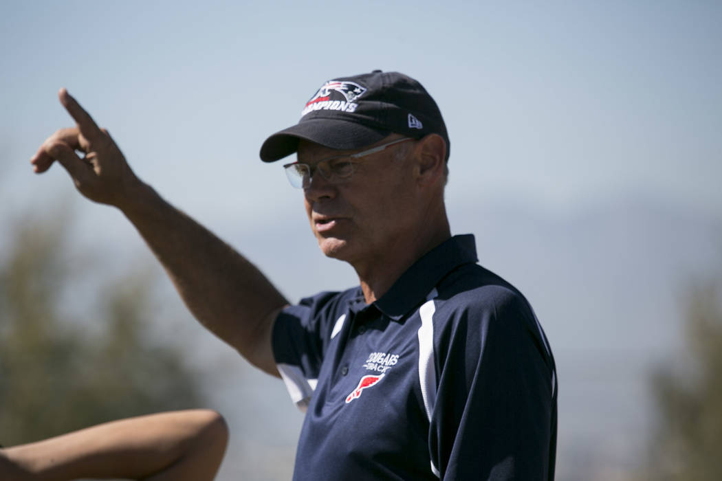 Head coach Rick Teller leads a warmup during a track and field practice at Coronado High Sch ...