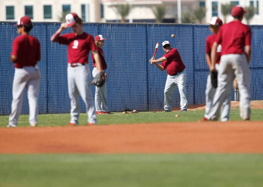 Desert Oasis players warm up before a high school baseball game against Sierra Vista at Sier ...