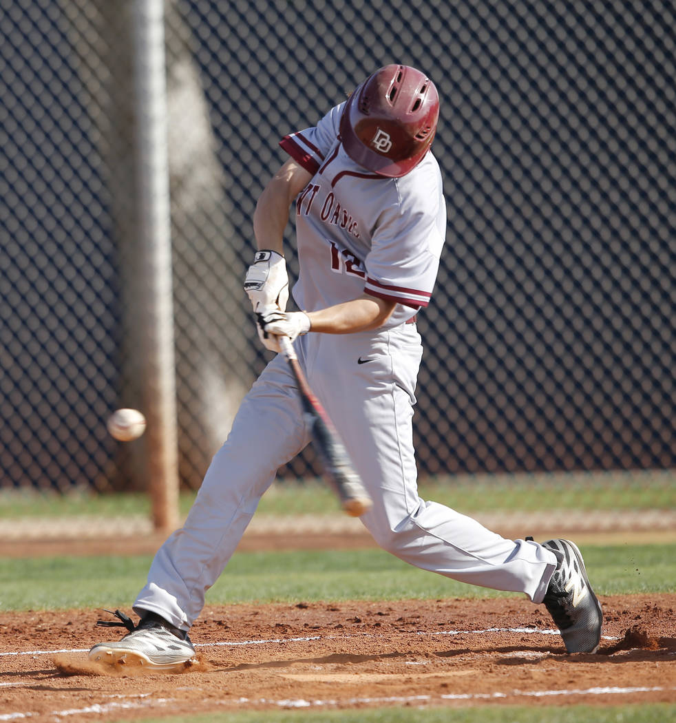 Desert Oasis’s Jason Sharman (12) swings during the third inning of a high school base ...