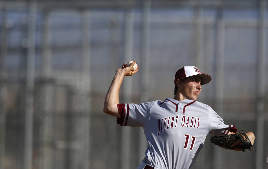 Desert Oasis’s Brett Brocoff (11) pitches during the third inning of a high school bas ...