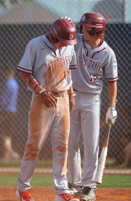 Desert Oasis’s Jason Sharman (12) congratulates Desert Oasis’s Brett Brocoff (11 ...